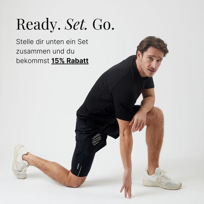 Kurze Lauftights Herren, schwarz, mit Tasche